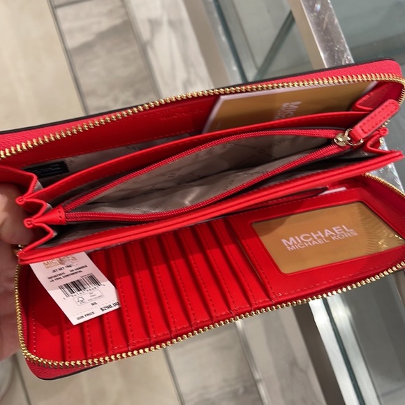 MICHAEL KORS Leather Continental Phone Holder Wristlet Wallet 
Dark Sungria
NWT